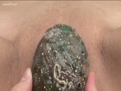 An Asian woman masturbated with marine life.